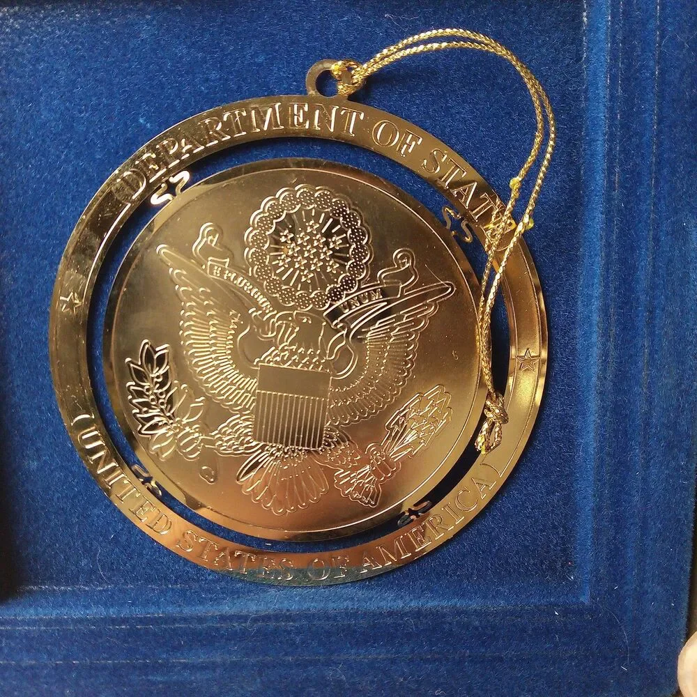 DEPARTMENT OF STATE GOLD TONE ORNAMENT IN BOX
